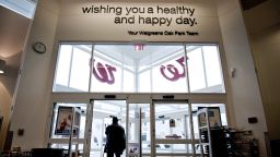 A customer exits a Walgreen Co. store in Oak Park, Illinois, U.S., on Tuesday, Dec. 20, 2011. Walgreen Co. is scheduled to release earnings data on Dec. 21. Photographer: Daniel Acker/Bloomberg via Getty Images