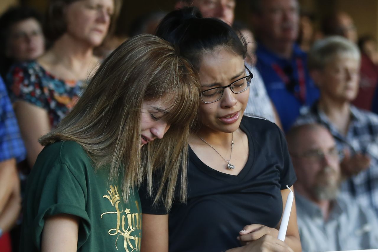 High School students Celeste Lujan, left, and Yasmin Natera mourn their friend Leilah Hernandez, one of the victims of the Saturday <a href="https://www.cnn.com/us/live-news/odessa-shooting/index.html" target="_blank">shooting in Odessa</a>, Texas,at a memorial service on Sunday, September 1, in Odessa. A <a href="https://www.cnn.com/2019/09/01/us/odessa-texas-shooting-sunday/index.html" target="_blank">gunman targeted shoppers</a> and vehicles at shopping centers in the areas of Odessa and Midland on Saturday, August 31, killing 5 and injuring at least 21.