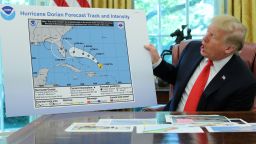 U.S. President Donald Trump holds a chart showing the original projected track of Hurricane Dorian that appears to have been extended with a black line to include parts of the Florida panhandle and of the state of Alabama during a status report meeting on the hurricane in the Oval Office of the White House in Washington, U.S., September 4, 2019. REUTERS/Jonathan Ernst     TPX IMAGES OF THE DAY