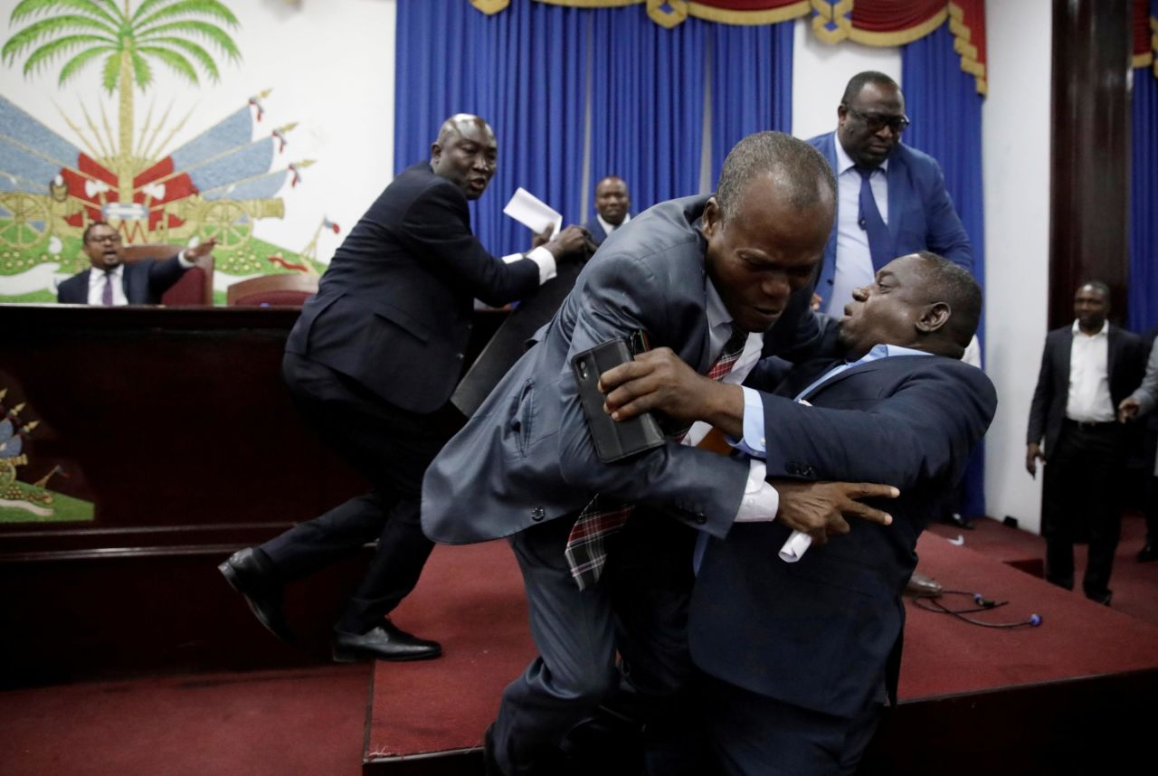 Deputies fight before a session to present the general policy of appointed Prime Minister Fritz William Michel at the Parliament in Port-au-Prince, Haiti, on Tuesday, September 3.