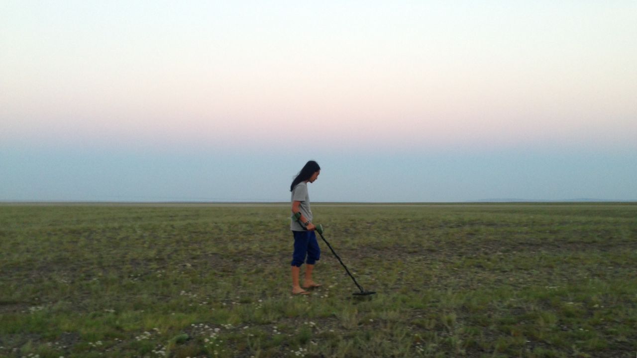 Zhang Bo looks for meteorites in Xinjiang, China, in 2016.