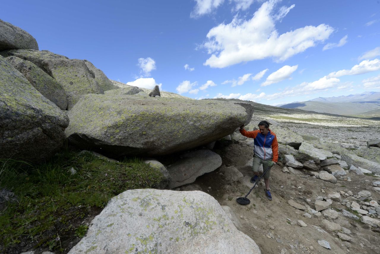 Zhang Bo looks for parts of "The Tear of Allah," a huge iron meteorite weighing almost 18 tons which was found in Altay in 1986.