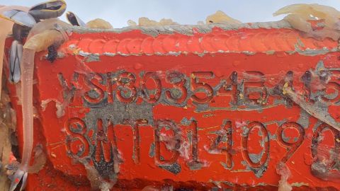 Foam-filled US Navy boat found with several goose barnacles from being lost at sea for a year.