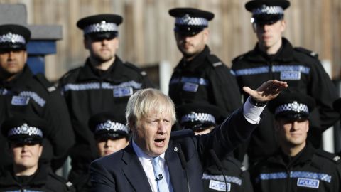 Boris Johnson makes a speech flanked by police cadets in West Yorkshire Thursday.