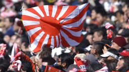 Rugby fans wave Japan's Rising Sun flag at Prince Chichibu Stadium on February 27, 2016 in Tokyo, Japan. 