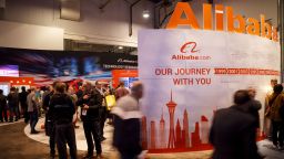 Attendees walk past the Alibaba Group Holding Ltd. booth at the 2019 Consumer Electronics Show (CES) in Las Vegas, Nevada, U.S., on Wednesday, Jan. 9, 2019. Dozens of companies will give presentations at the event, where attendance is expected to top 180,000, with the trade war between the U.S. and China as well as Apple's sales woes looming over the gathering. Photographer: Patrick T. Fallon/Bloomberg via Getty Images