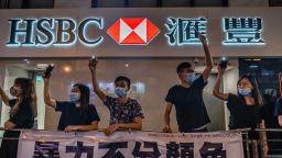 HONG KONG, CHINA - 2019/08/23: Protesters form a human chain in front of a HSBC bank branch.
Thousands of Hong Kong protesters link hands to form human chain across the city to call for democracy during the Hong Kong way event. The chains, which traced three subway routes, totaled around 40 kilometers (25 miles) in length. The protesters said they were inspired by the "Baltic Way', when millions created a chain across three countries (Estonia, Latvia and Lithuania) to protest Soviet occupation exactly 30 years ago, and is the latest in the nearly 11-week-old movement that began with calls to scrap a now-suspended extradition bill and has broadened to include demands for full democracy and an independent inquiry into alleged police brutality. (Photo by Geovien So/SOPA Images/LightRocket via Getty Images)