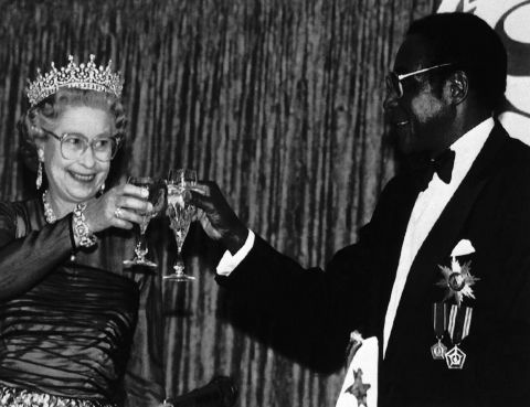 Britain's Queen Elizabeth II toasts Mugabe during a banquet in the Queen's honor in Harare in October 1991. The Queen had last visited the territory that became Zimbabwe in 1947.