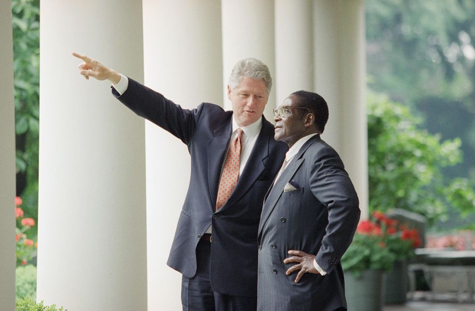 US President Bill Clinton gestures while talking to Mugabe after a White House meeting in Washington in May 1995.
