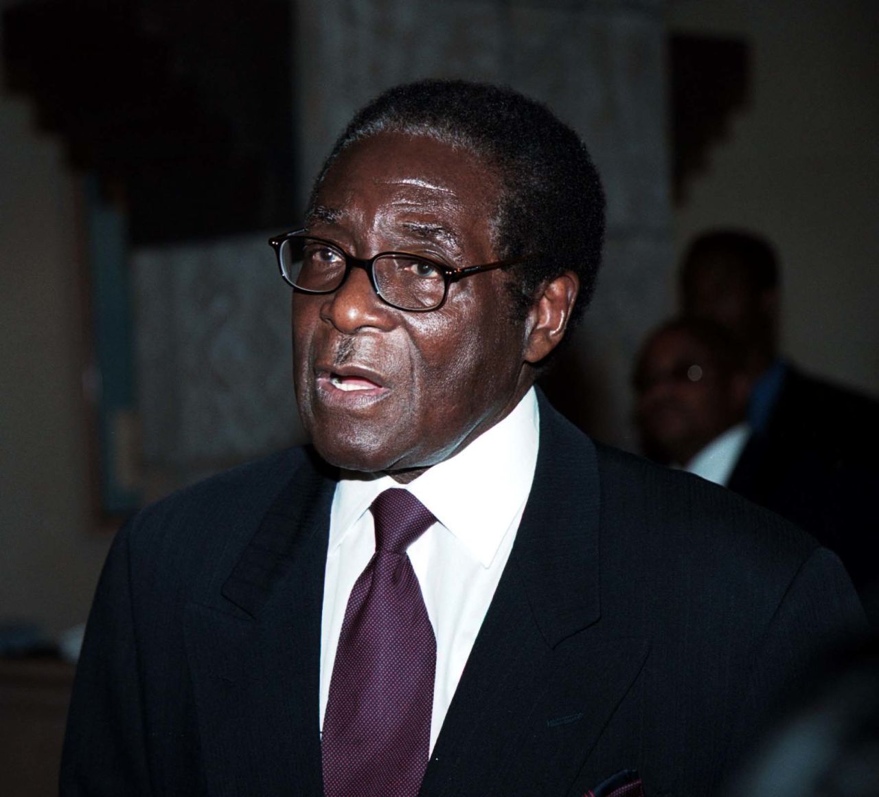 Mugabe speaks during the Southern Africa trade and investment summit in Windhoek, Namibia, in October 2000. Earlier in the year, he implemented a controversial land-reform program that saw the seizure of land from some 4,000 white farmers.