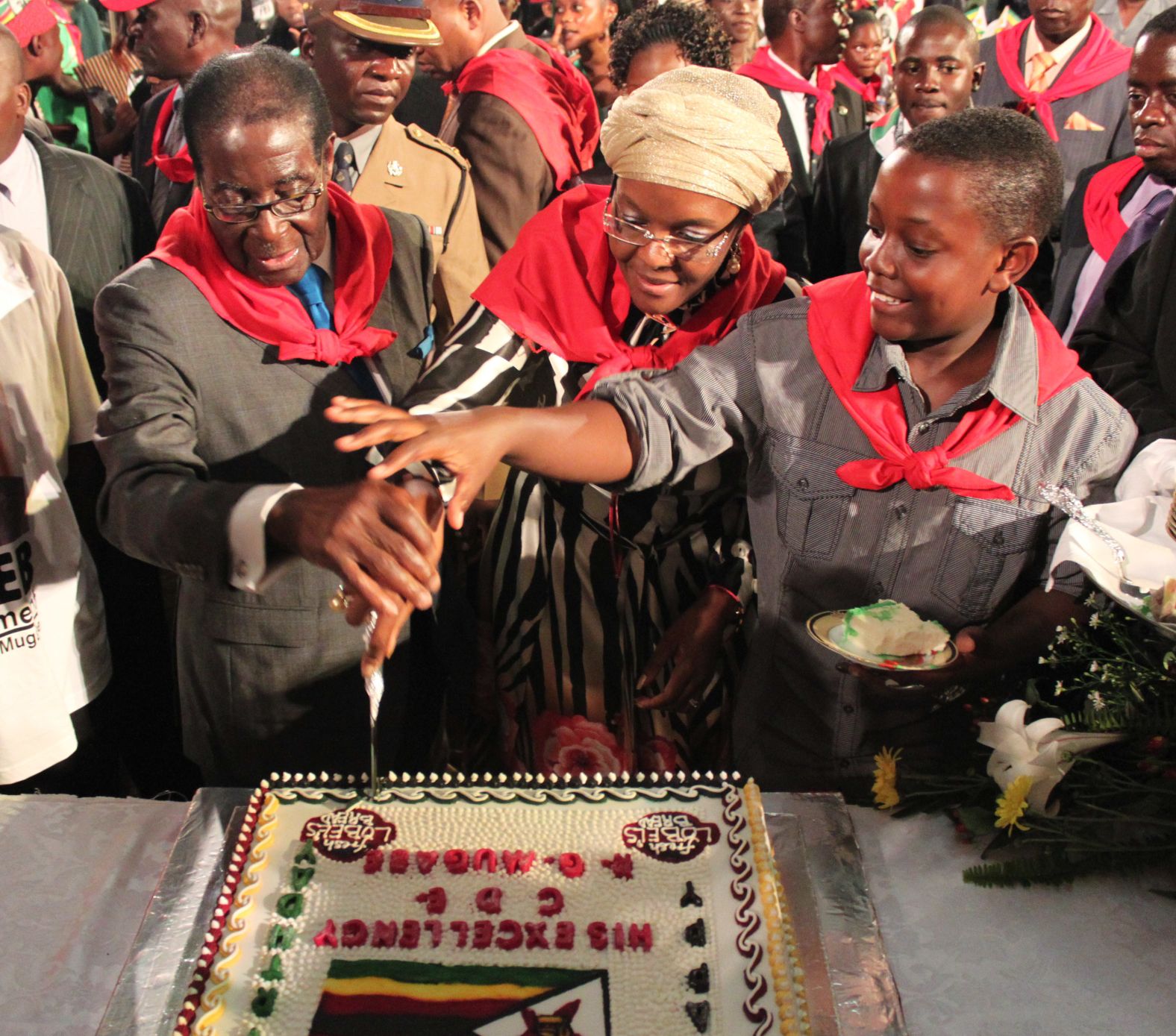 Mugabe cuts his birthday cake with his wife, Grace, and son Bellarmine Chatunga during celebrations in Harare in February 2011. Mugabe was turning 87.