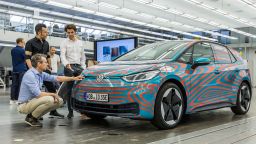 Employees inspect a Volkswagen ID.3 pre-production model electric automobile inside the Volkswagen AG design studio in Wolfsburg, Germany, on Friday, July 5, 2019. Traditional carmakers will be showing off electric models like VWs ID.3 and Porsche AG's Taycan in Frankfurt next week alongside profit mainstays of gas-guzzling sport utility vehicles. Photographer: Rolf Schulten/Bloomberg via Getty Images