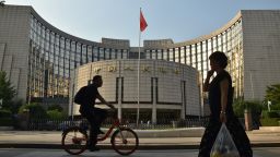 BEIJING, CHINA - JUNE 18: A pedestrian walks past the People's Bank of China (PBOC) headquarters on June 18, 2019 in Beijing, China. China's import and export of trade in goods reached 12.1 trillion yuan in the first five months of this year, increasing 4.1 percent year-on-year, according to the General Administration of Customs. (Photo by Zhang Gang/Visual China Group via Getty Images)