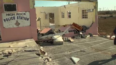 The police station's roof is gone, and a concrete wall lies ruined.