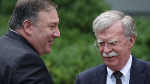 Mike Pompeo talks with  John Bolton before a in  Rose Garden news conference in June 2018.