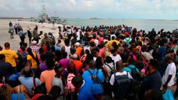 People wait in Marsh Harbour Port to be evacuated to Nassau, in Abaco, Bahamas, Friday, Sept. 6, 2019. The evacuation is slow and there is frustration for some who said they had nowhere to go after the Hurricane Dorian splintered whole neighborhoods. (AP Photo/Gonzalo Gaudenzi)
