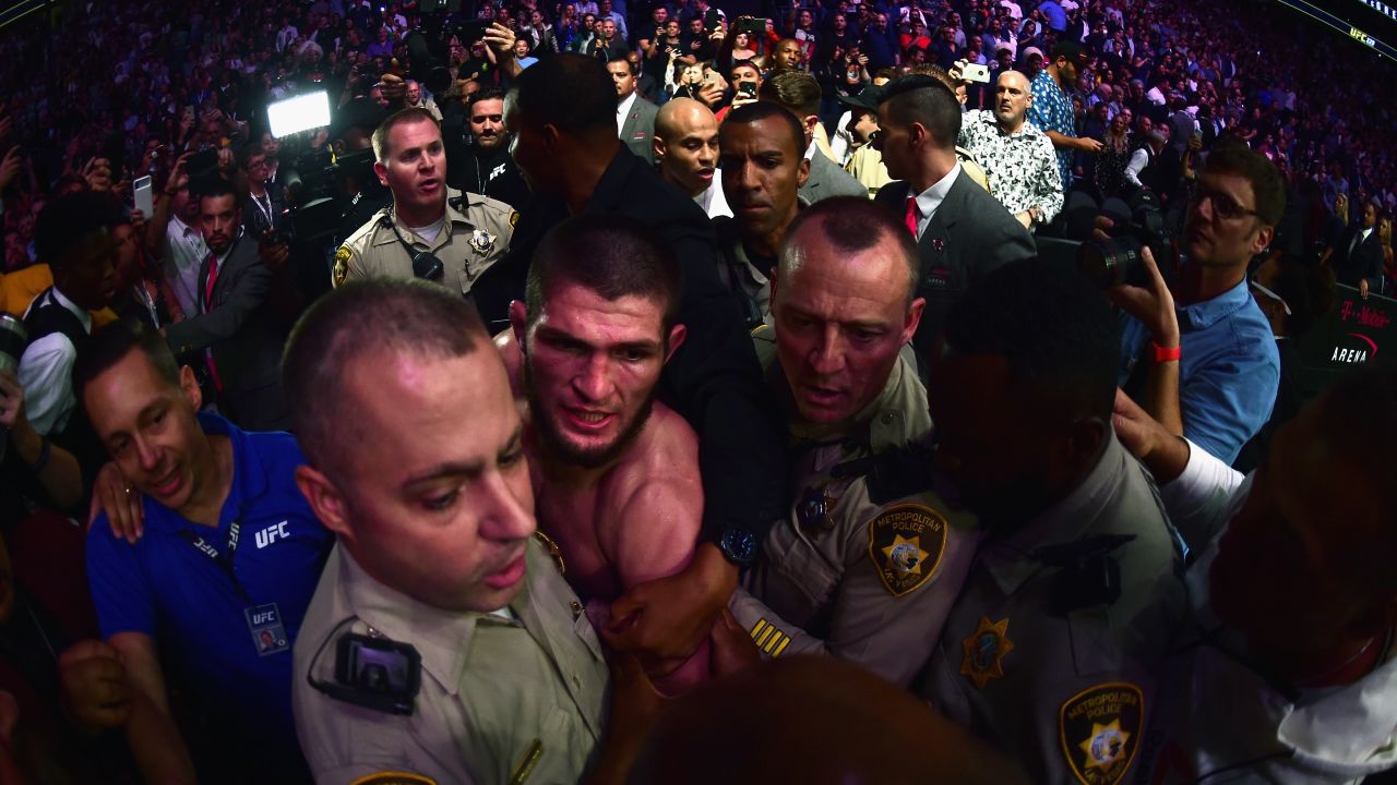 Nurmagomedov is escorted out of the arena after defeating Conor McGregor.