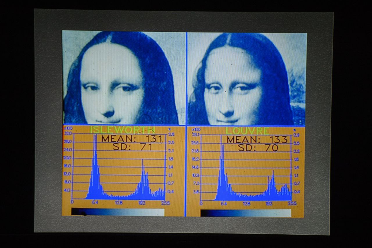 A screen shows scientific tests carried out on the "Isleworth Mona Lisa" taken during an event arranged by the Mona Lisa Foundation in 2012.