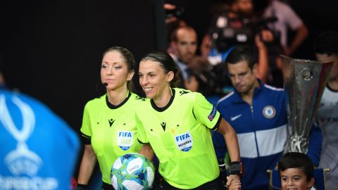 Stephanie Frappart and Manuela Nicolosi walk out for the UEFA Super Cup final.