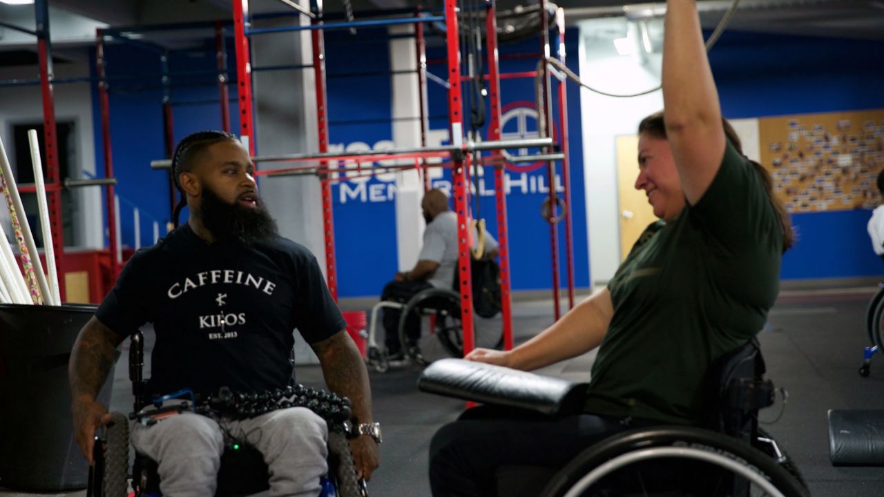 Wesley Hamilton trains a participant in his Disabled But Not Really program.