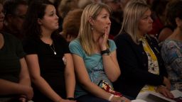 Members of the audience react during a Gun Safety Town Hall in Aurora, Colorado on August 25.
