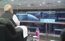 Prime Minister Narendra Modi  watching the landing.