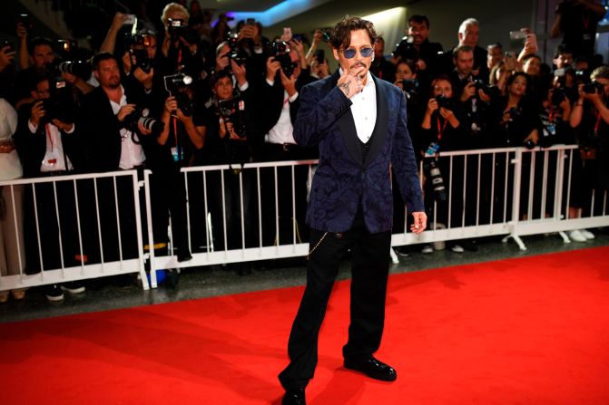 Actor Johnny Depp poses for photographers upon arrival at the premiere of the film "Waiting for the Barbarians."
