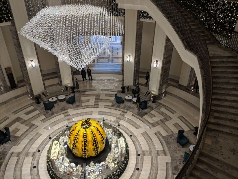 <strong>A lobby like no other:</strong> Yayoi Kusama's giant glass polka-dotted pumpkin sits confidently under a crystal chandelier in the center of the resort's main lobby area. <br />
