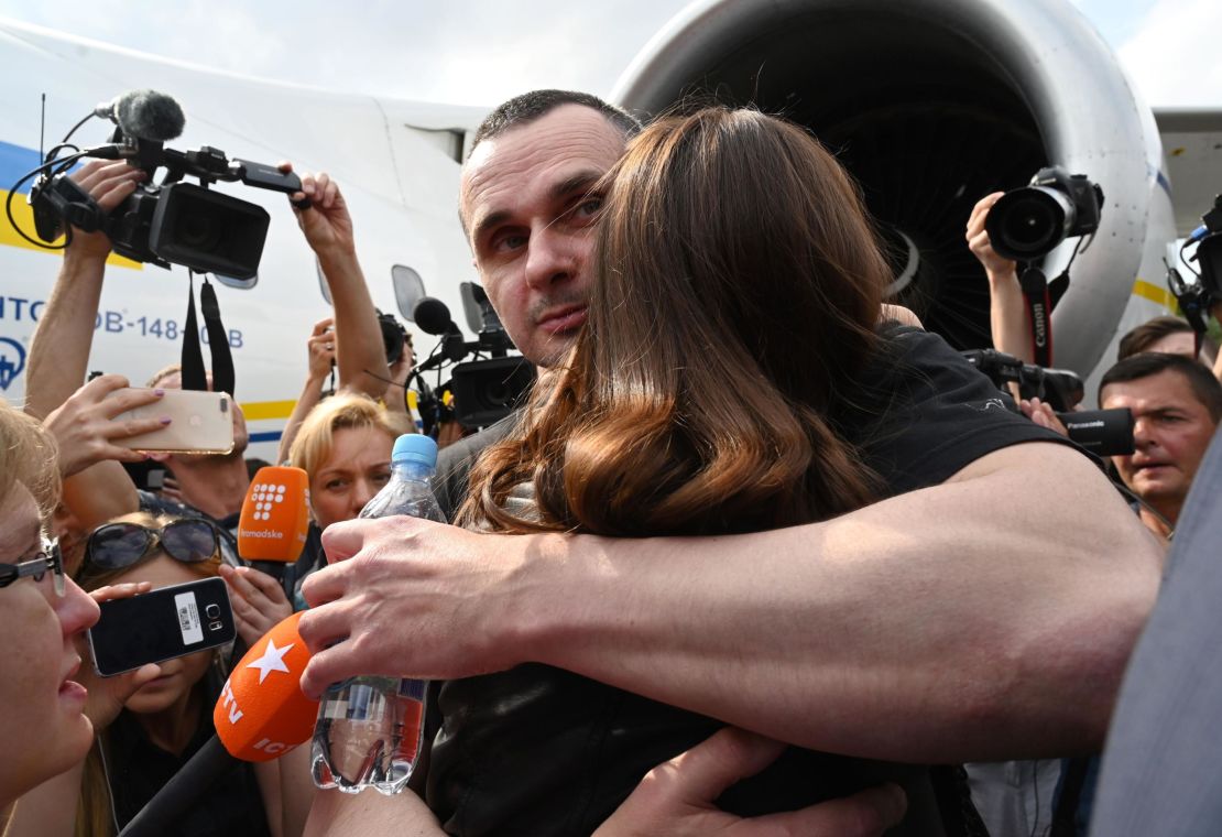 Oleg Sentsov hugs his daughter in Kyiv after being released from Russian prison in 2019.