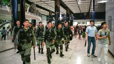 Riot police patrol the Hong Kong MTR underground metro station in Hong Kong on September 7.