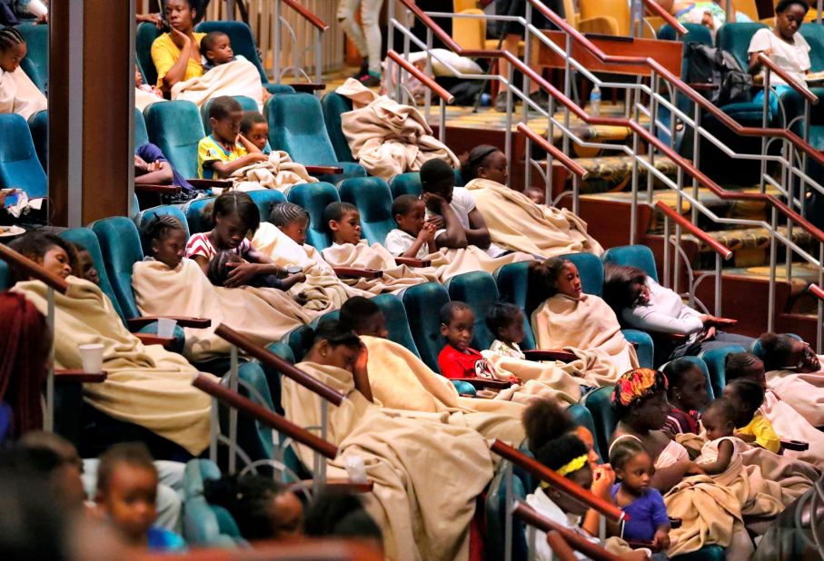 Evacuees from the Bahamas rest on a Royal Caribbean cruise ship after it arrived in Freeport on September 7. The ship delivered thousands of meals and cases of bottled water.