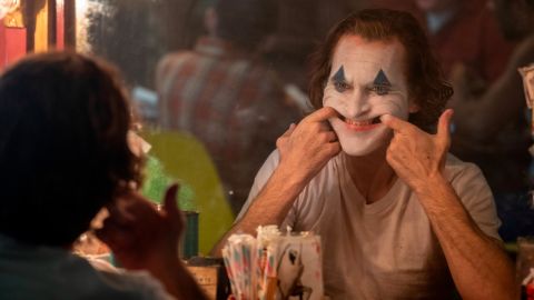 Joaquin Phoenix practices his creepy smile in "Joker."