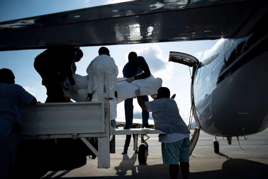 Bodies are loaded onto a plane in Marsh Harbour on Saturday, September 7.