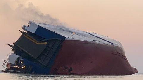 Smoke billows from the Golden Ray after it overturned in St. Simons Sound.