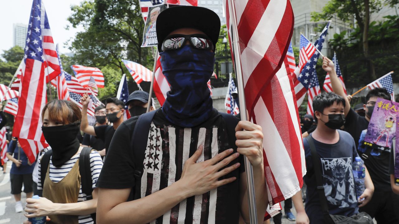 Protesters shout slogans during a protest in Hong Kong, Sunday, Sept. 8, 2019. Demonstrators in Hong Kong plan to march to the U.S. Consulate on Sunday to drum up international support for their protest movement, a day after attempts to disrupt transportation to the airport were thwarted by police. (AP Photo/Kin Cheung)