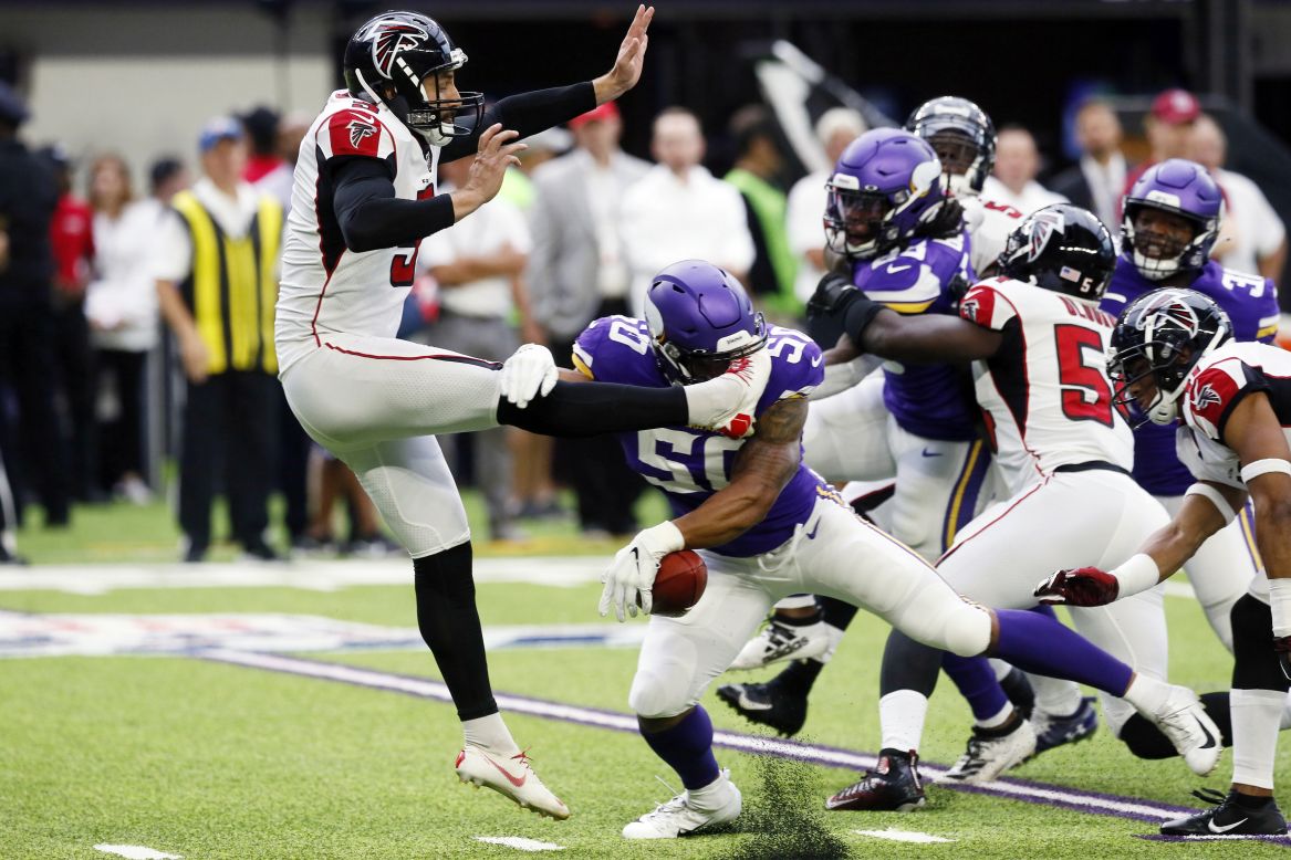 Minnesota Vikings linebacker Eric Wilson blocks a punt by Atlanta Falcons punter Matt Bosher during the first half of an NFL football game in Minneapolis on Sunday, September 8.