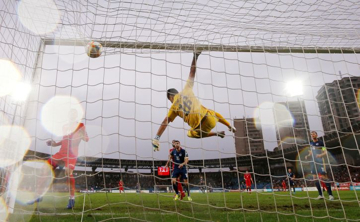 Armenia's Aram Airapetyan jumps to block a shot in a game against Bosnia and Herzegovina in Yerevan, Armenia, on September 8.