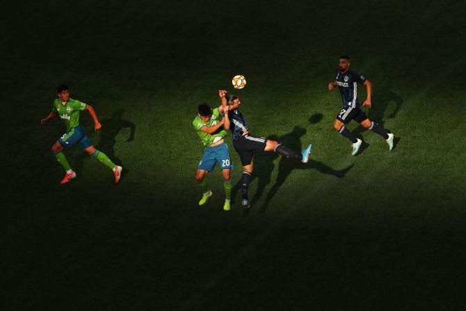 Kim Kee-hee of the Seattle Sounders and Zlatan Ibrahimovic of the Los Angeles Galaxy compete for the ball in the second half of their game at CenturyLink Field in Seattle, Washington, on September 1.