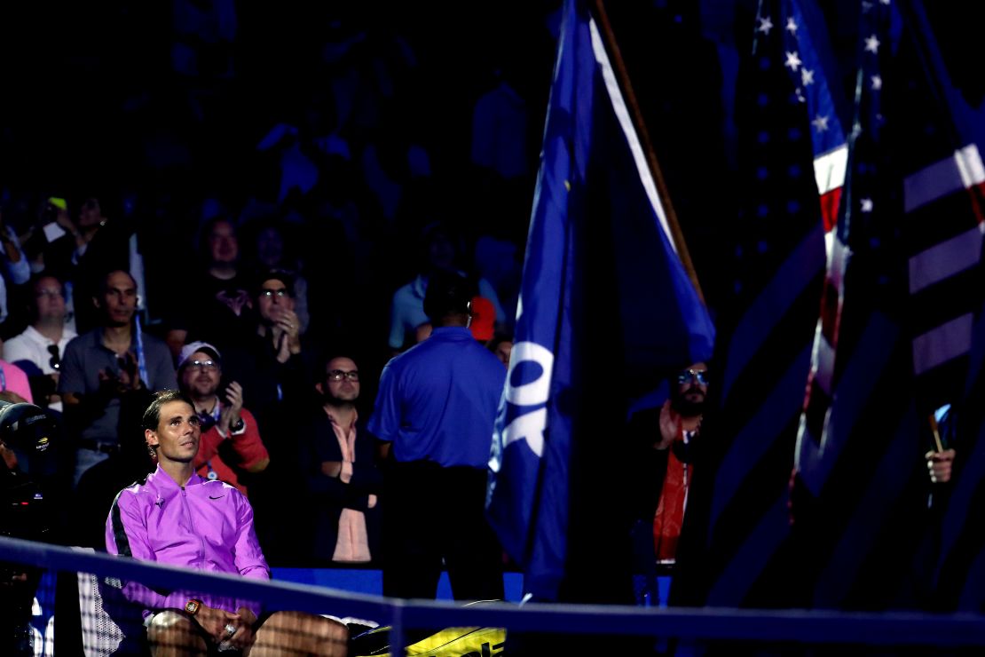 Rafael Nadal looks on before the trophy presentation ceremony as the video montage plays. 
