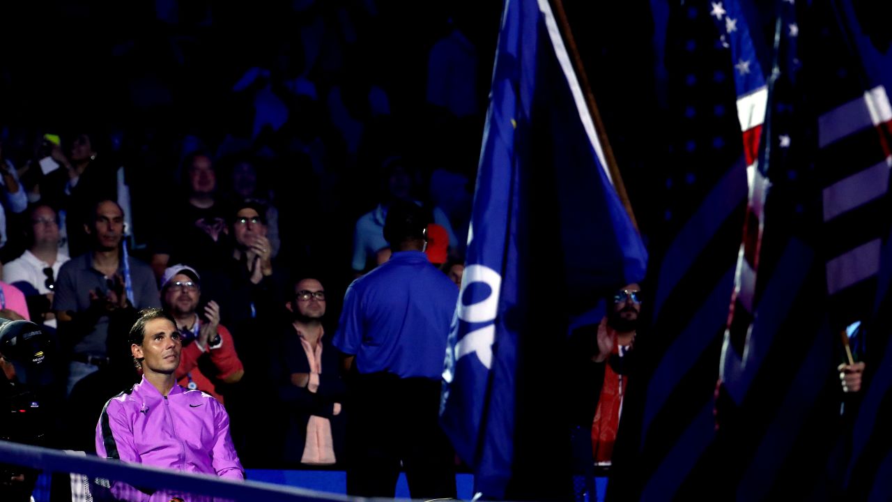 Rafael Nadal looks on before the trophy presentation ceremony as the video montage plays.