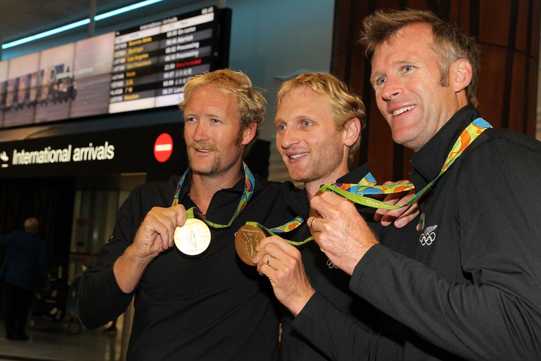 Olympic rowing gold medalists Eric Murray (left),  Hamish Bond (center), and Mahe Drysdale with their 2016 medals.
