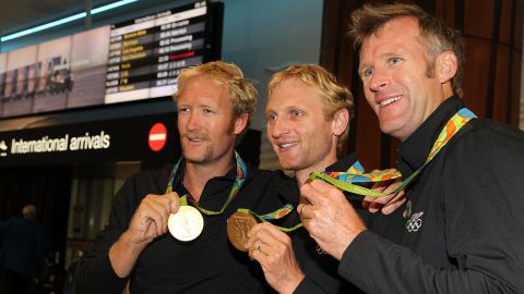 Olympic rowing gold medalists Eric Murray (left), Hamish Bond (center), and Mahe Drysdale with their 2016 medals.