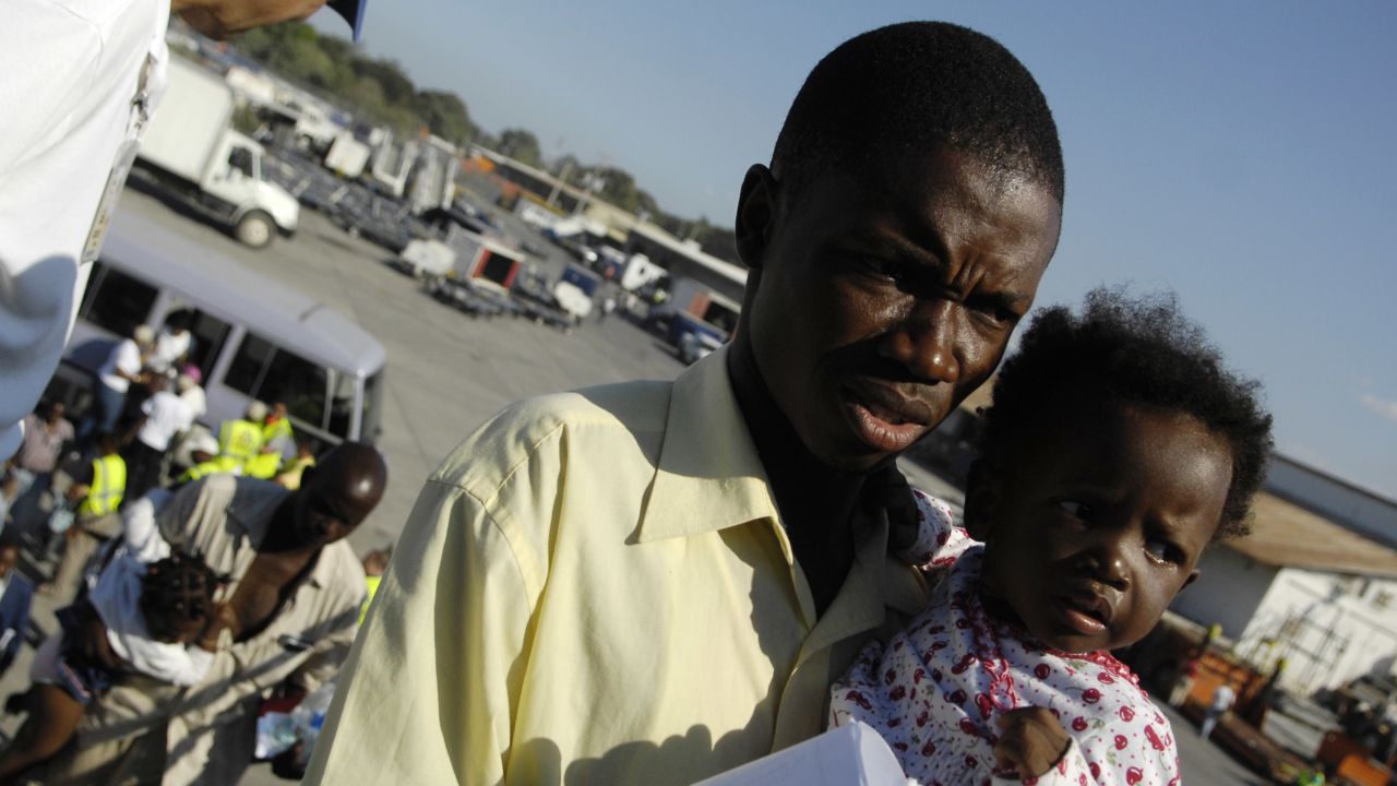 Unidentified evacuees board a relief flight to Chicago from earthquake-ravaged Port-au-Prince, Haiti, in January 2010.
