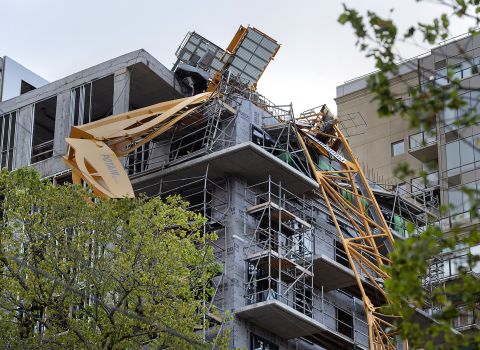 A toppled building crane is draped over a new construction project in Halifax, Nova Scotia, on September 9.