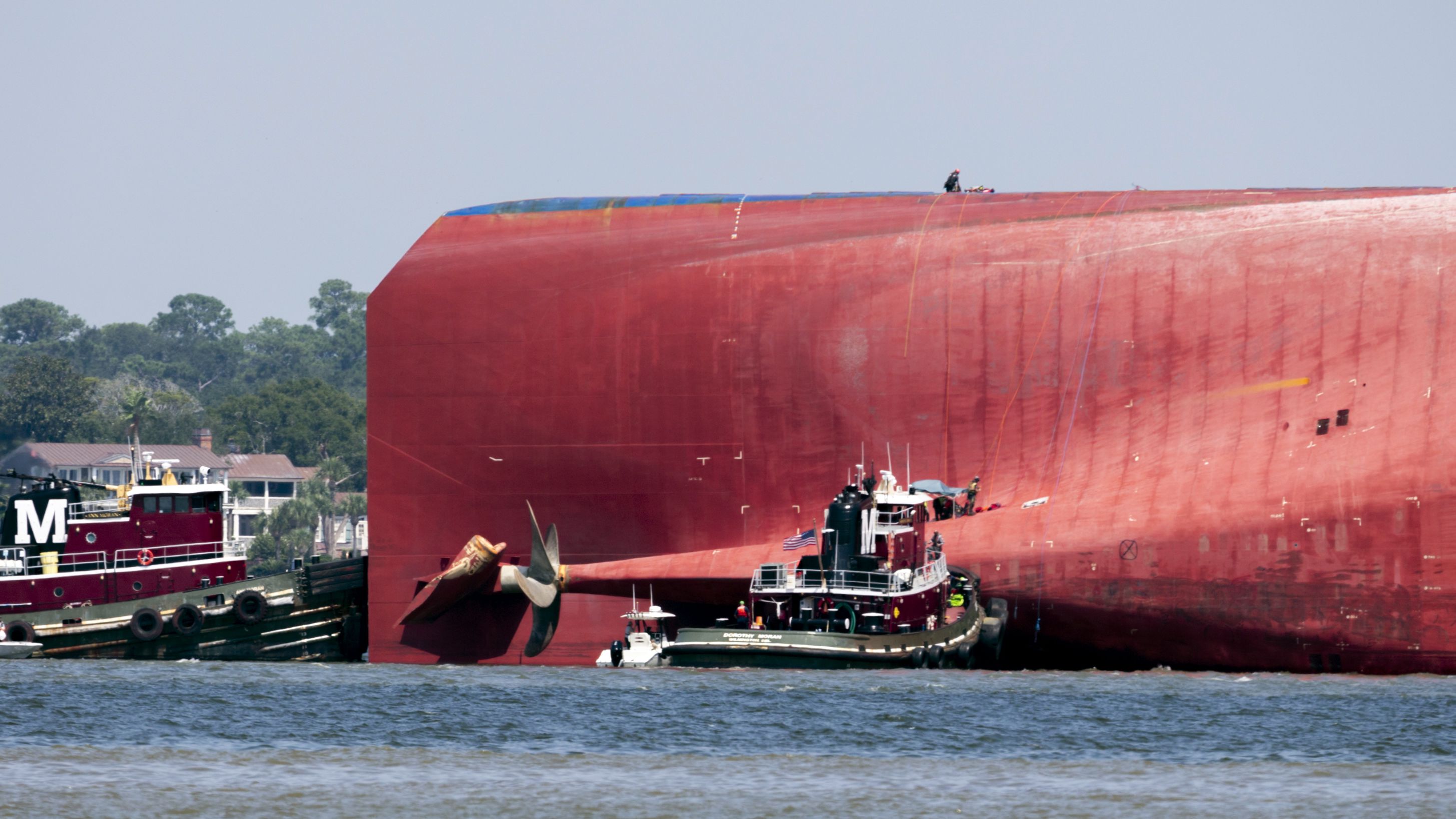 Rescuers work near the stern of the Golden Ray.