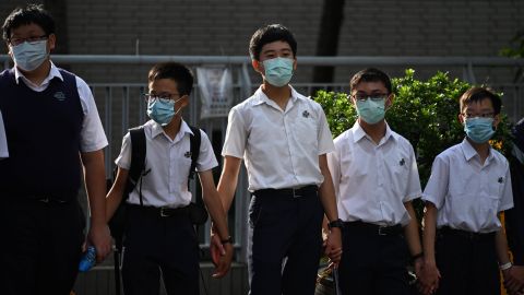 Students in the Mid-Levels area take part in a joint school human chain rally in Hong Kong early on September 9, 2019. - The protests over the last 14 weeks were lit by a now-scrapped plan to allow extraditions to the authoritarian mainland, seen by opponents as the latest move by China to chip away at the international finance hub's unique freedoms. (Photo by Anthony WALLACE / AFP) (Photo credit should read ANTHONY WALLACE/AFP/Getty Images)