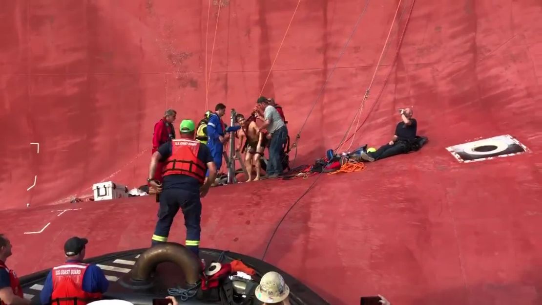 Rescuers extract the final crew member from the Golden Ray. 