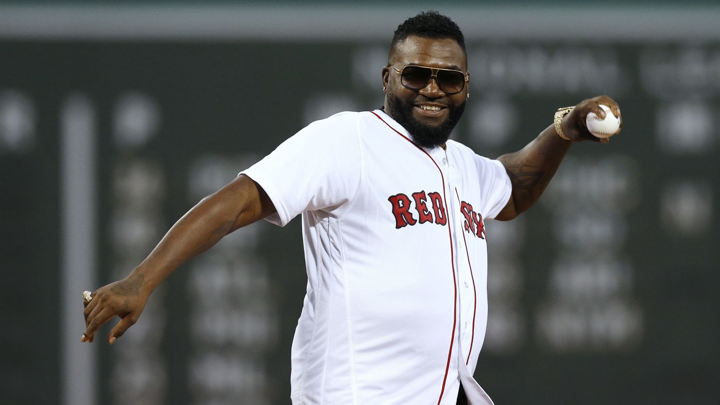 Former Boston Red Sox player David Ortiz throws out a ceremonial first pitch before a baseball game in Boston's Fenway Park on Monday.