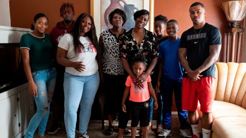 Crystal Mason, center, has three children and is a caretaker for her brother's four children.