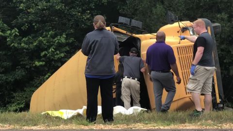 A school bus sits on its side after a crash in Benton County, Mississippi on Tuesday.